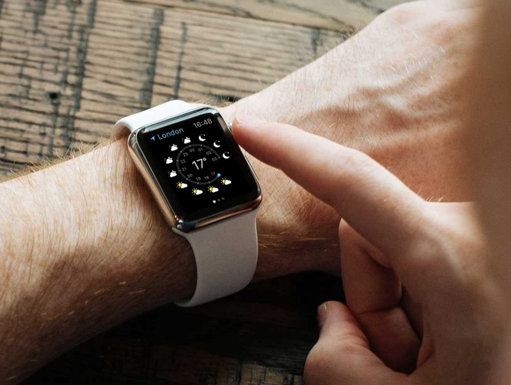 Free Apple Watch With White Wrist Band In Action PSD Mockup