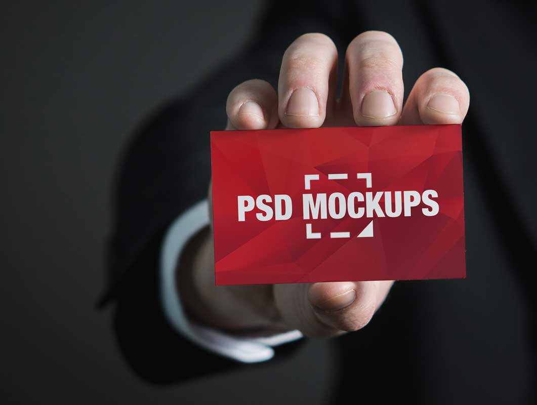Free Business Card In Hand Front Face PSD Mockup